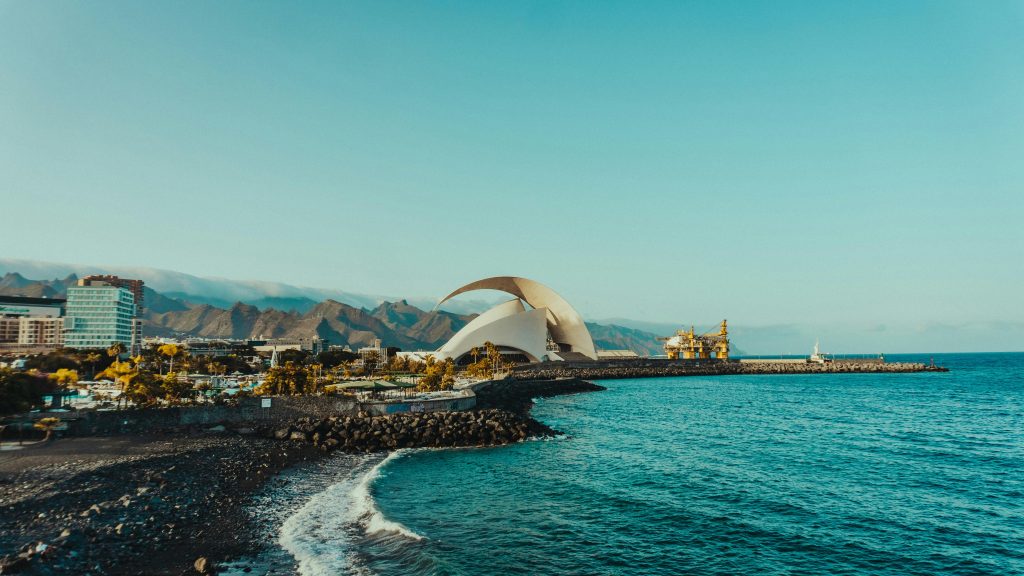 Explore the vibrant coastal cityscape with modern architecture and scenic ocean views.